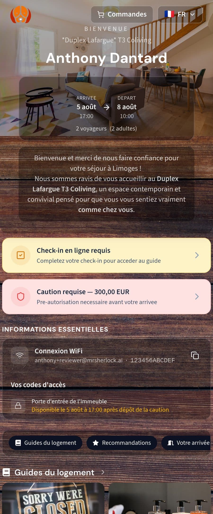 Écran d’accueil de la Guest App Mr Sherlock avec l’encart « Check-in en ligne requis », la caution demandée et les codes d’accès masqués.